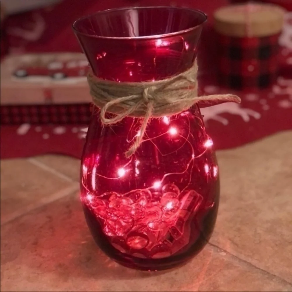 Red vase with string fairy lights